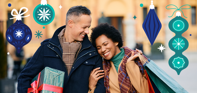 Man and woman laughing and shopping together with holiday ornaments overlaid on the photo