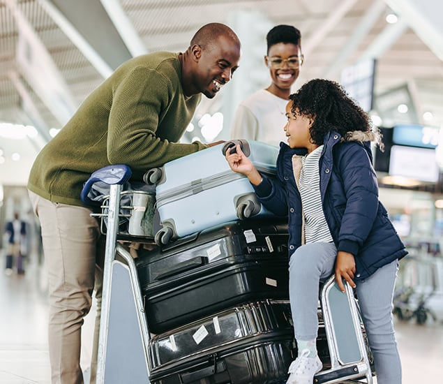 An image of a family with luggage in the airport
