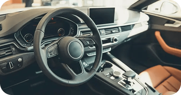 an image of a luxury car interior viewed from the driver seat window