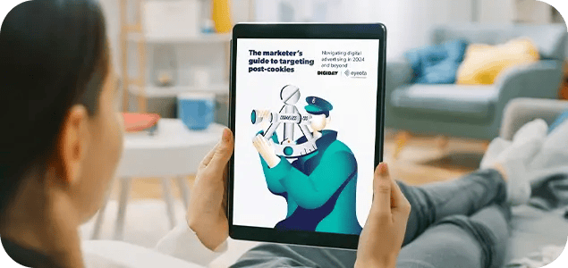 a picture of the Eyeota eBook open on a tablet being held in a person's hands
